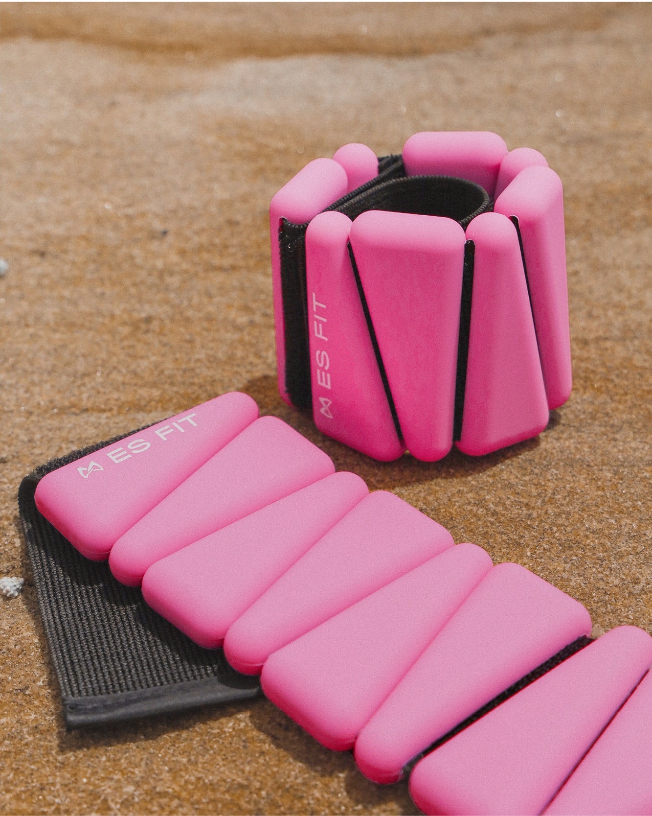 Adjustable & versatile Australian Ankle Weights & Wrist Weights. Use for a variety of benefits & workout exercises. Great for walking, pilates, toning + more. pink weight.